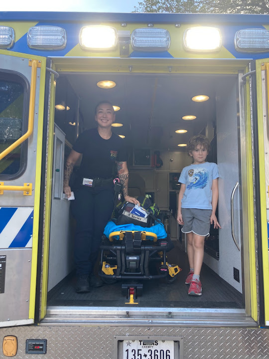 EMT and kid in ambulance